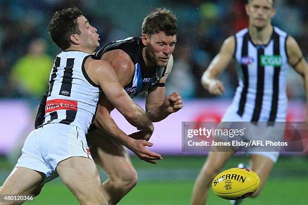 Jarryd Blair of the Magpies tackles Brad Ebert of the Power during the 2015 AFL round 15 match between Port Adelaide Power and the Collingwood...