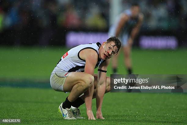 Tom Langdon of the Magpies looks dejected during the 2015 AFL round 15 match between Port Adelaide Power and the Collingwood Magpies at the Adelaide...