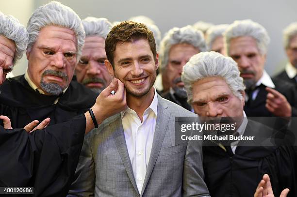 Actor Julian Morris of “Hand of God” poses with Ron Perlman impersonators at The Getty Images Portrait Studio powered by Samsung Galaxy At Comic-Con...