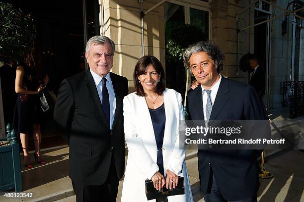 Dior Couture Sidney Toledano, Mayor of Paris Anne Hidalgo and Executive President of federation Francaise de la Couture Stephane Wargnier attend the...