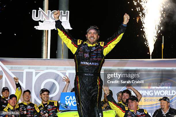 Matt Crafton, driver of the Ideal Door/Menards Toyota, celebrates after winning the NASCAR Camping World Truck Series UNOH 225 at Kentucky Speedway...