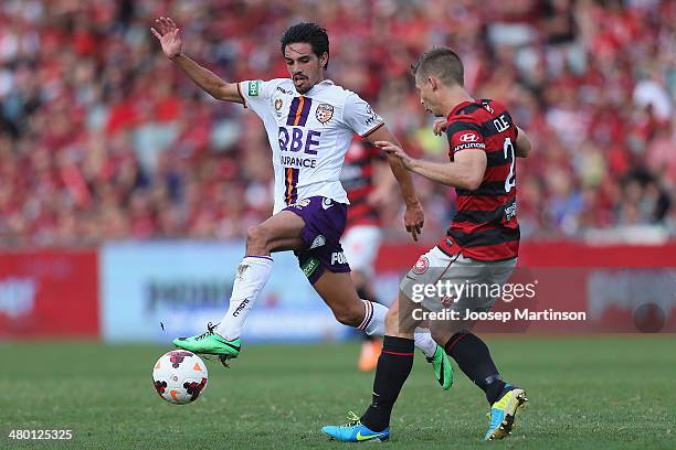 Jamie Maclaren of the Glory competes for the ball with Shannon Cole of the Wanderers during the round 24 A-League match between the Western Sydney...