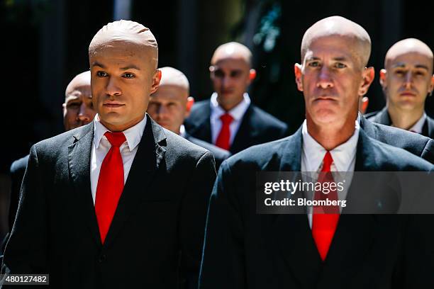 Actors dressed as Agent 47 promote IO Interactive AS' Hitman video game during the Comic-Con International convention in San Diego, California, U.S.,...