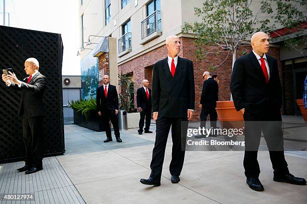 People dressed as Agent 47 promote IO Interactive AS' Hitman video game during the Comic-Con International convention in San Diego, California, U.S.,...