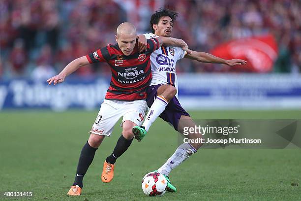 Aaron Mooy of the Wanderers competes for the ball with Ryan Edwards of the Glory during the round 24 A-League match between the Western Sydney...