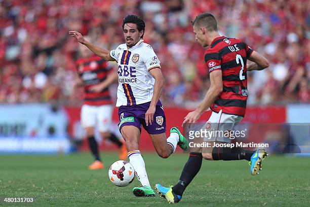 Jamie Maclaren of the Glory competes for the ball with Shannon Cole of the Wanderers during the round 24 A-League match between the Western Sydney...