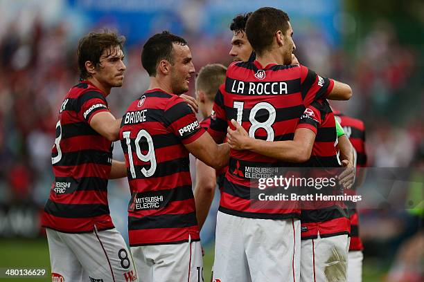 Jerome Polenz of the Wanderers is congratulated by team mates after scoring during the round 24 A-League match between the Western Sydney Wanderers...