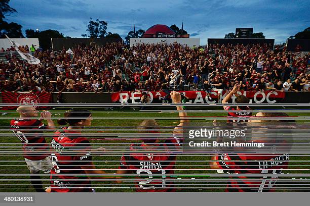 Wanderers players acknowledge the Red & Black Block during the round 24 A-League match between the Western Sydney Wanderers and Perth Glory at...