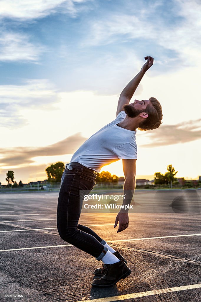 Fifties Greaser Bending Backwards in Sunset