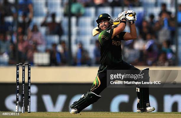 Kamran Akmal of Pakistan hits the bal ltowards the boundary during the ICC World Twenty20 Bangladesh 2014 match between Pakistan and Australia at...