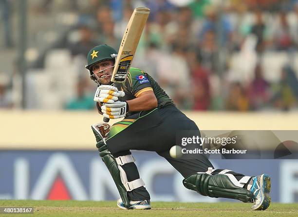 Kamran Akmal of Pakistan hits a boundary during the ICC World Twenty20 Bangladesh 2014 match between Australia and Pakistan at Sher-e-Bangla Mirpur...