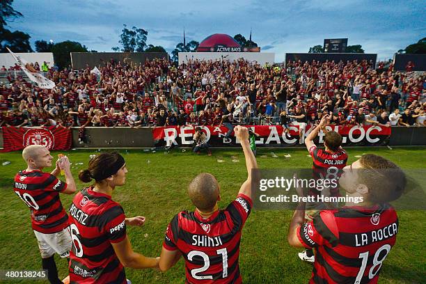 Wanderers players acknowledge the Red & Black Block during the round 24 A-League match between the Western Sydney Wanderers and Perth Glory at...