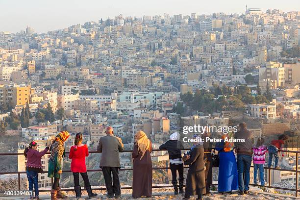arab visitors at the citadel, amman, jordan - amman people stock pictures, royalty-free photos & images