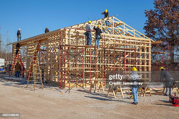 team of man framing a building - shed bildbanksfoton och bilder