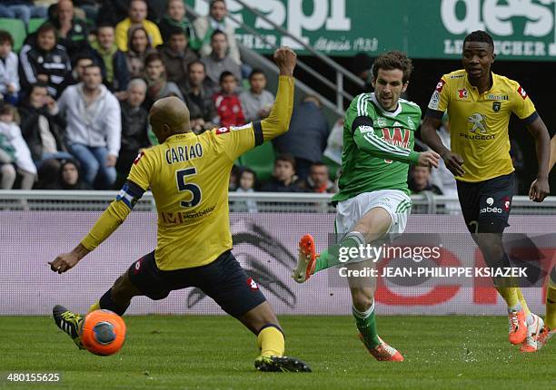 St Etienne's midfielder Benjamin Corgnet shoots the ball past Sochaux' Brazilian midfielder Carlos Alberto Carlao in front of Sochaux' Senegalese...