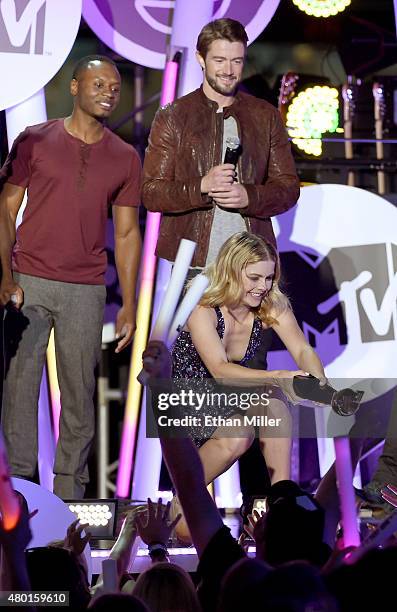 Actors Malcolm Goodwin, Robert Buckley and Rose McIver accept the award for Best New Fandom of the Year for "iZombie" onstage during the MTV Fandom...