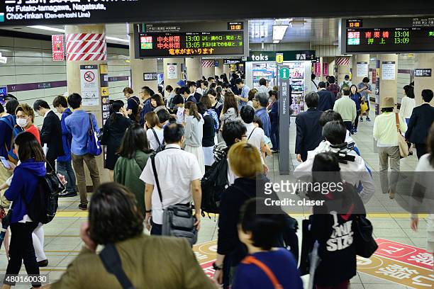 commuters in the tokyo subway - japanese exit sign stock pictures, royalty-free photos & images
