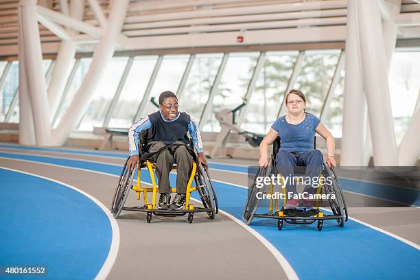 two handicapped friends at the gym - wheelchair sport stock pictures, royalty-free photos & images