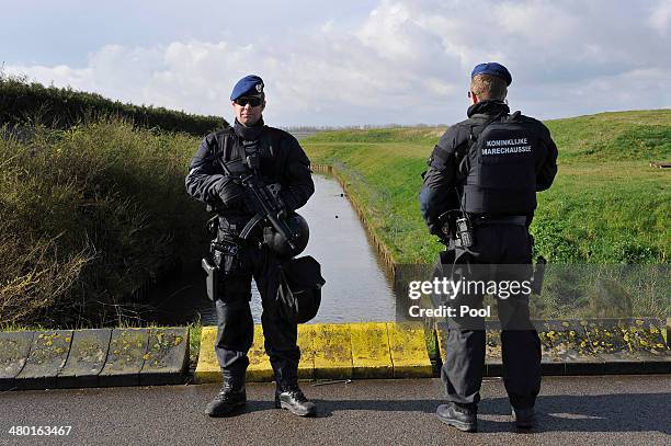 Security stands guard as world leaders arrive at Amsterdam Schiphol Airport to attend the 2014 Nuclear Security Summit March 23, 2014 in...