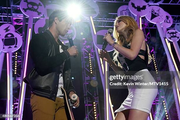 Co-hosts/actors Tyler Posey and Bella Thorne perform onstage during the MTV Fandom Fest San Diego Comic-Con at PETCO Park on July 9, 2015 in San...