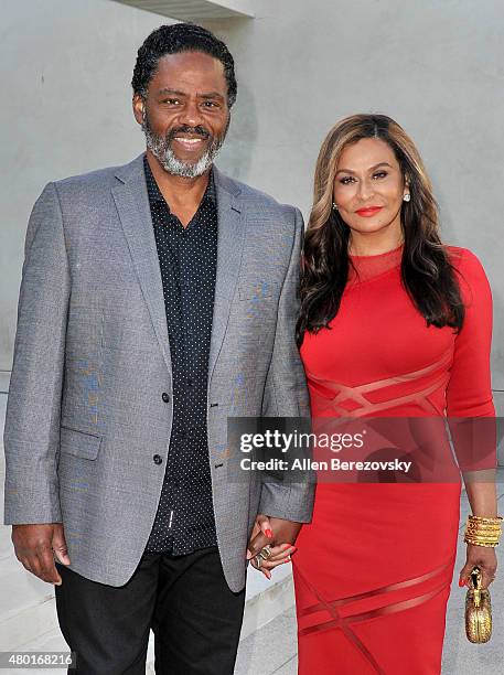 Fashion designer Tina Knowles Lawson and husband Richard Lawson attend a Champagne Toast in honor of July cover star Tina Knowles Lawson hosted by...