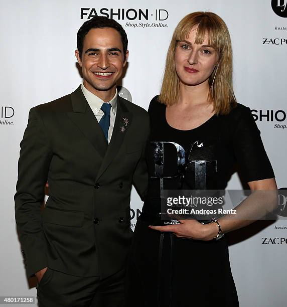 Zac Posen and DfT 2015 winner Mareike Massing pose after the 'Designer for Tomorrow' by Peek & Cloppenburg and Fashion ID show during the...
