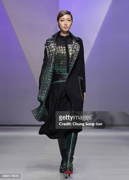 Model showcases designs on the runway during the Lie Sang Bong show as part of Seoul Fashion Week F/W 2014 on March 23 in Seoul, South Korea.