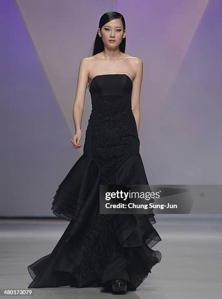 Model showcases designs on the runway during the Lie Sang Bong show as part of Seoul Fashion Week F/W 2014 on March 23 in Seoul, South Korea.