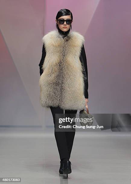 Model showcases designs on the runway during the Lie Sang Bong show as part of Seoul Fashion Week F/W 2014 on March 23 in Seoul, South Korea.