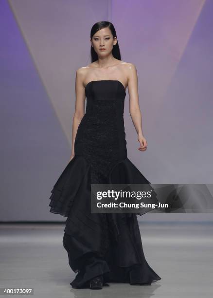 Model showcases designs on the runway during the Lie Sang Bong show as part of Seoul Fashion Week F/W 2014 on March 23 in Seoul, South Korea.