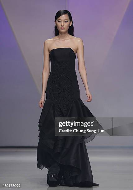 Model showcases designs on the runway during the Lie Sang Bong show as part of Seoul Fashion Week F/W 2014 on March 23 in Seoul, South Korea.