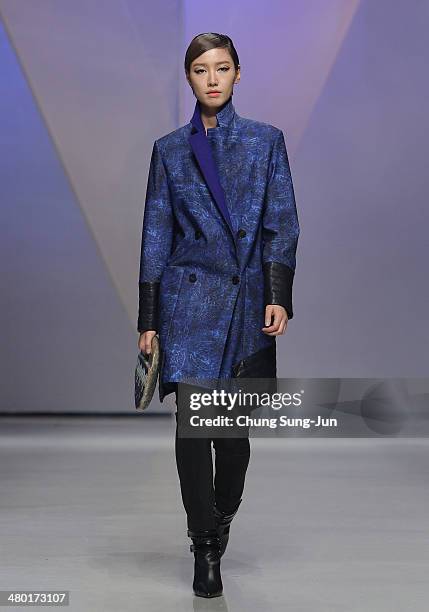 Model showcases designs on the runway during the Lie Sang Bong show as part of Seoul Fashion Week F/W 2014 on March 23 in Seoul, South Korea.