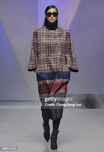 Model showcases designs on the runway during the Lie Sang Bong show as part of Seoul Fashion Week F/W 2014 on March 23 in Seoul, South Korea.