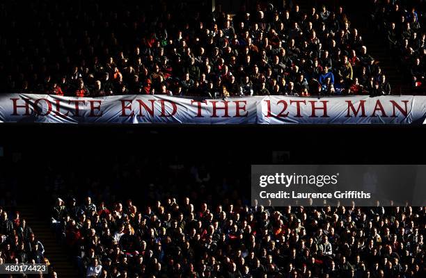 Aston Villa fans cheer on their team during the Barclays Premier League match between Aston Villa and Stoke City at Villa Park on March 23, 2014 in...
