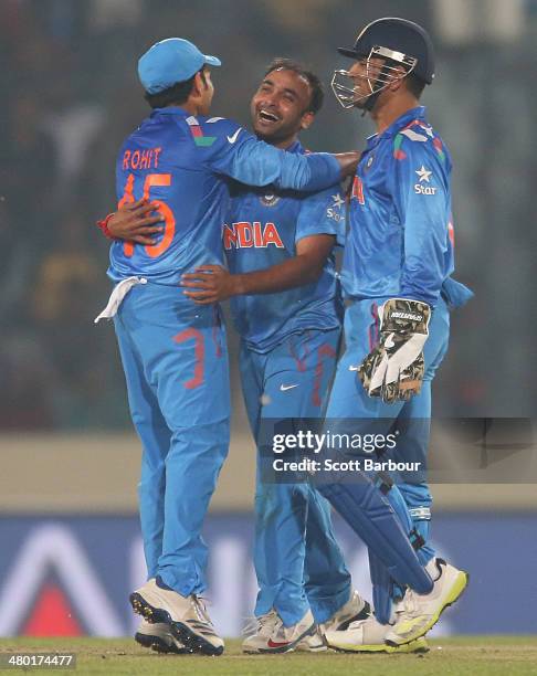 Amit Mishra celebrates after dismissing Marlon Samuels of the West Indies during the ICC World Twenty20 Bangladesh 2014 match between the West Indies...