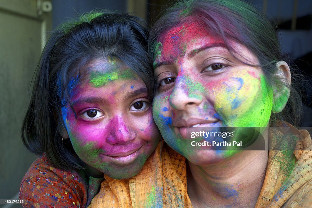 Indian Woman with her daughter,Holi Festival