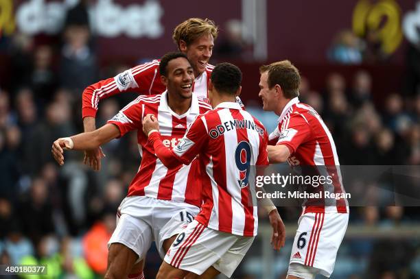 Steven N'Zonzi of Stoke is congratulated by teammates after scoring his team's third goal during the Barclays Premier League match between Aston...