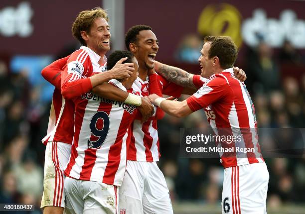 Steven N'Zonzi of Stoke is congratulated by teammates after scoring his team's third goal during the Barclays Premier League match between Aston...