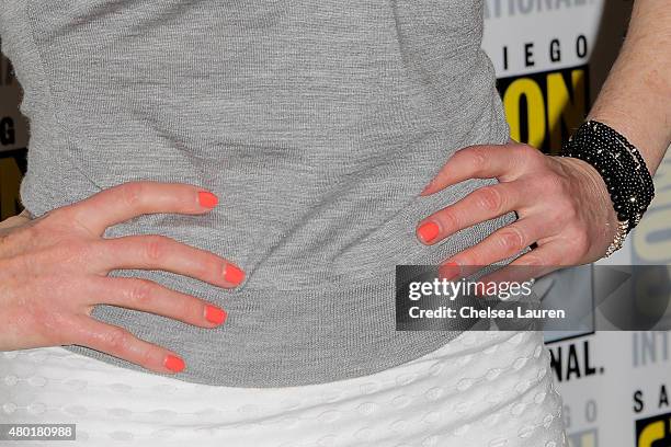 Actress Marg Helgenberger, nail and jewelry detail, attends the CBS Television Studios press room during Comic-Con International on July 9, 2015 in...