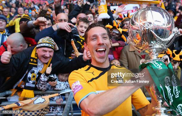 Tom Champion of Cambridge United celebrates with the supporters during the FA Carlsberg Trophy Final 2014 at Wembley Stadium on March 23, 2014 in...