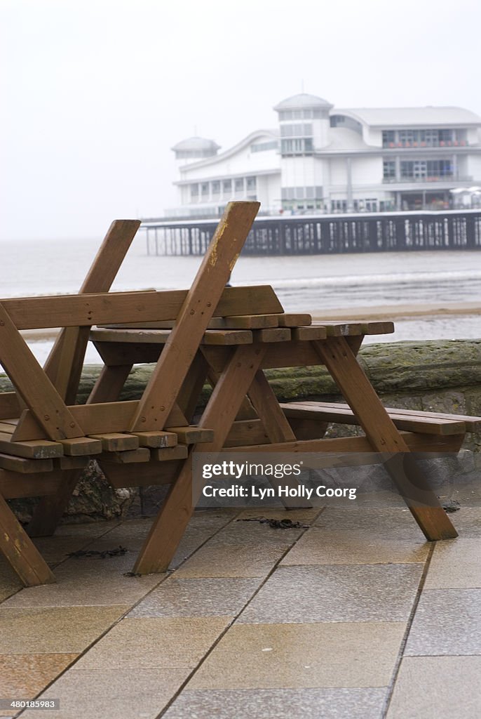 Upturned wooden tables at out of season seaside