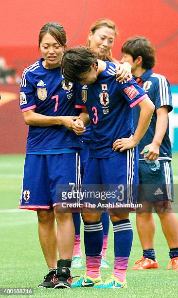 Azusa Iwashimizu of Japan is consoled by her team mate Kozue Ando after the FIFA Women's World Cup 2015 Final between USA and Japan at BC Place...