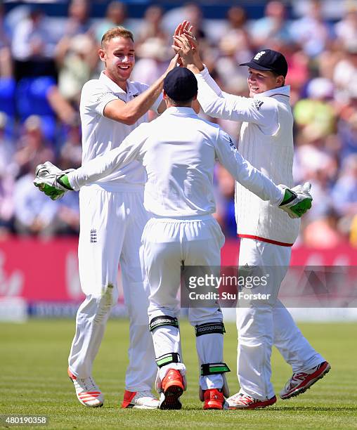 England bowler Stuart Broad celebrates with wicketkeeper Jos Buttler and catcher Gary Ballance after dismissing Mitchell Johnson during day three of...