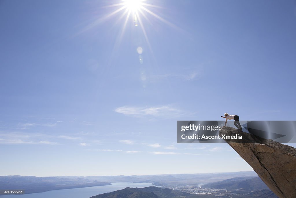 Woman standing on pinnacle end