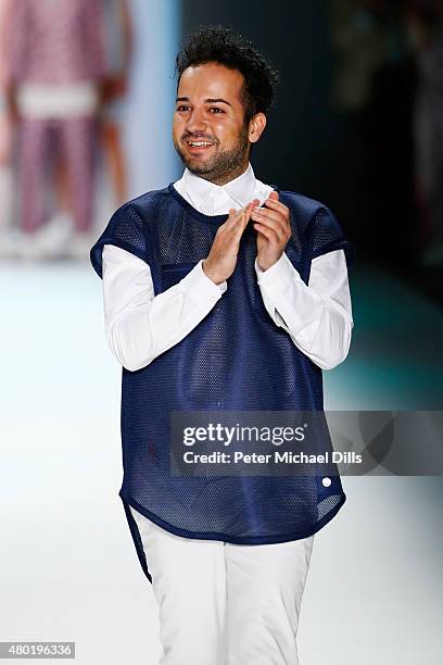 Designer Emre Erdemoglu walks the runway after his show during the Mercedes-Benz Fashion Week Berlin Spring/Summer 2016 at Brandenburg Gate on July...