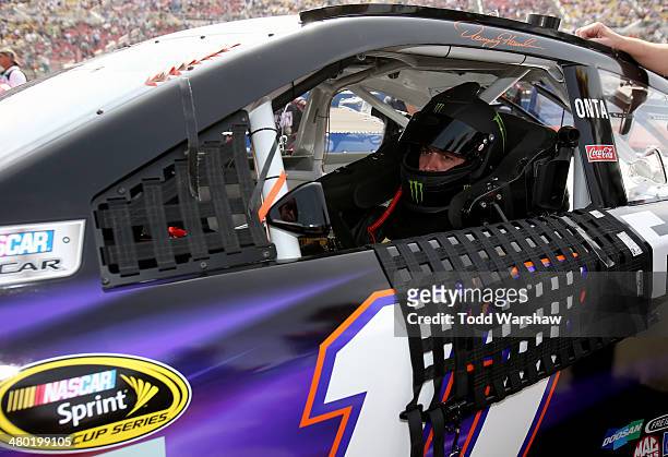 Sam Hornish Jr., driver of the FedEx Express Toyota, prepares for the NASCAR Sprint Cup Series Auto Club 400 at Auto Club Speedway on March 23, 2014...