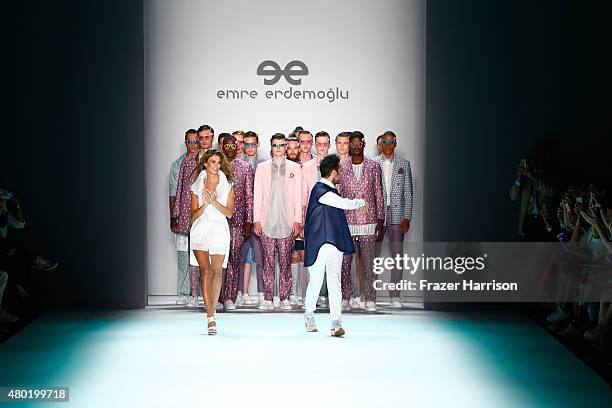 Designer Emre Erdemoglu and a model walk the runway after his show during the Mercedes-Benz Fashion Week Berlin Spring/Summer 2016 at Brandenburg...