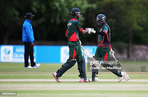 Morris Ouma and Irfan Karmin of Kenya celebrate victory during the ICC World Twenty20 India Qualifier between Canada and Kenya at Myreside Cricket...