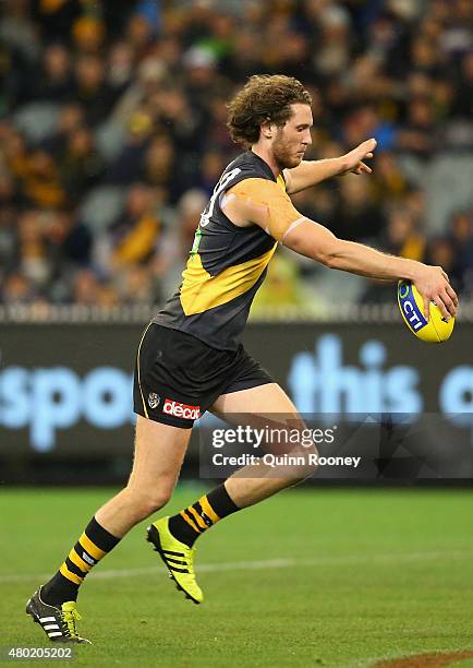 Tyrone Vickery of the Tigers kicks during the round 15 AFL match between the Richmond Tigers and the Carlton Blues at Melbourne Cricket Ground on...