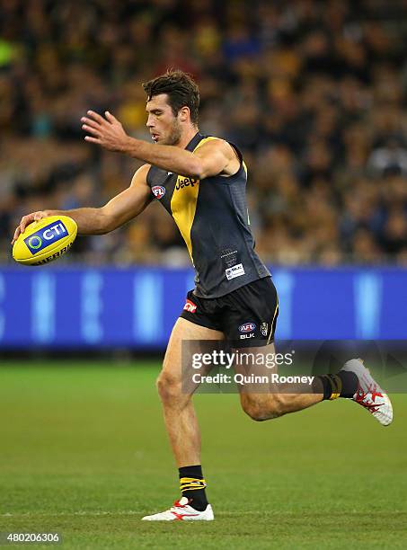 Alex Rance of the Tigers kicks during the round 15 AFL match between the Richmond Tigers and the Carlton Blues at Melbourne Cricket Ground on July...